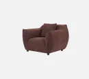 Three-quarter angled view of the 115cm wide Nearly Famous armchair in Chestnut Weave upholstery, highlighting its deep seat from Cocohills.