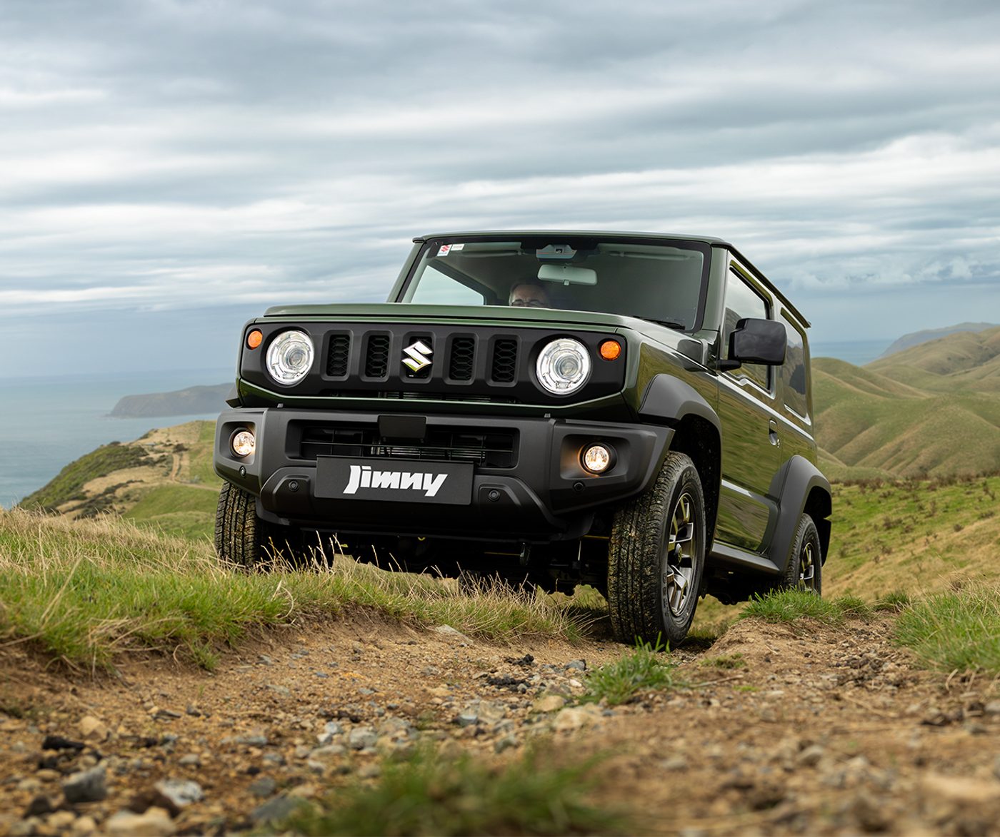 Suzuki Jimny DR WDing Over Hill